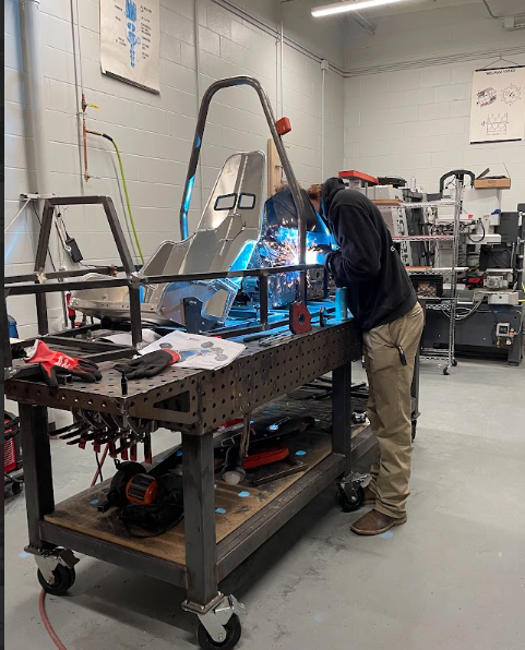 student welds race car