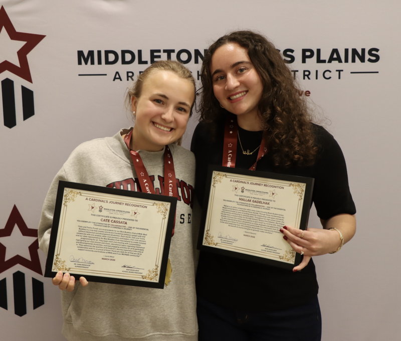 Cate Cassata and Mallak Gadelhak smiling and holding certificates