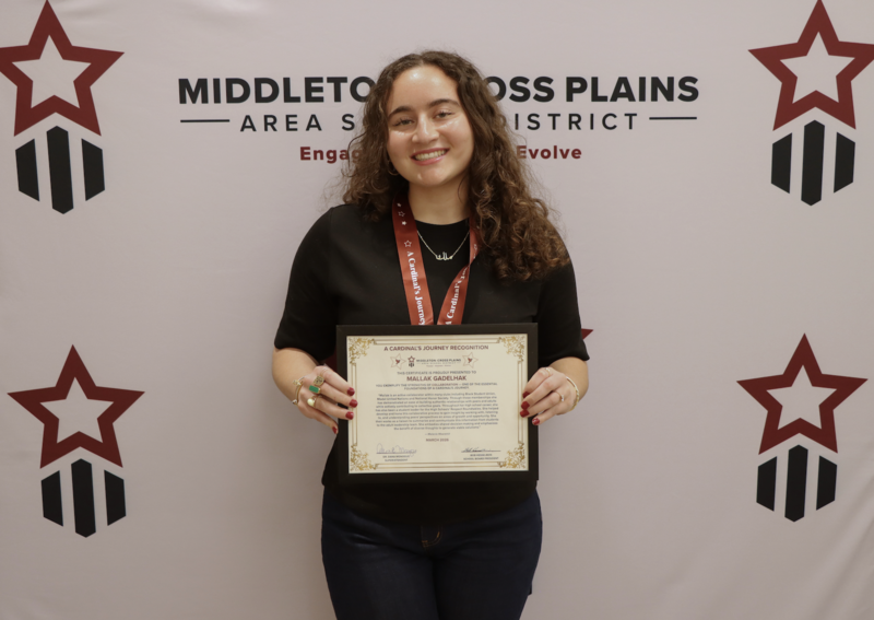 Mallak Gadelhak smiling and holding a certificate