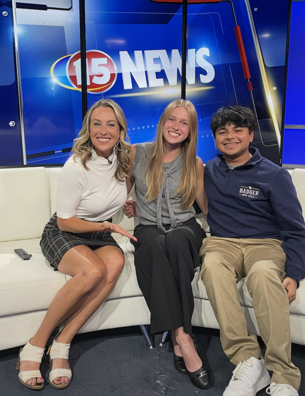 Beatrice Norman and Rohan Dileep smiling during interview with WMTV 15 News anchor Leigh Mills