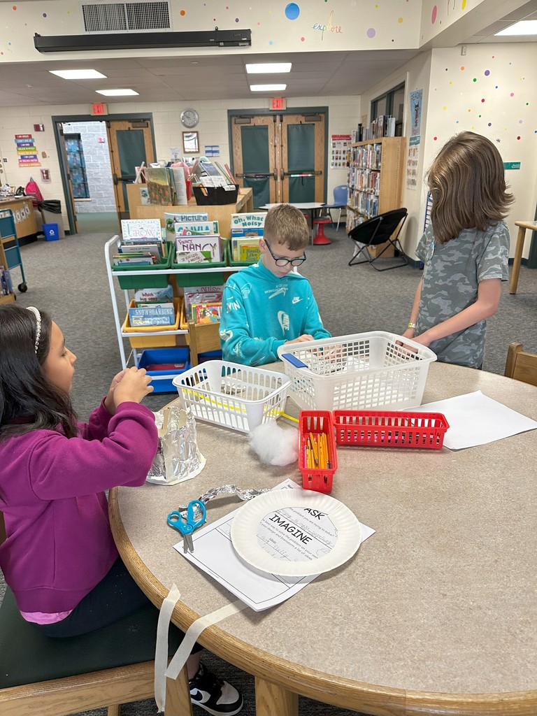 Students created containers for their eggs and dropped them from the playground.
