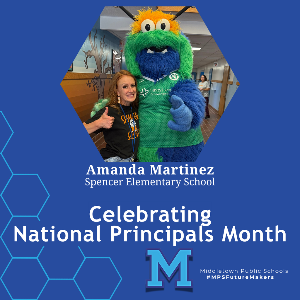 A woman in a black t-shirt giving a thumbs up next to a tall, fuzzy green and blue monster mascot. The image celebrates National Principals Month and includes school branding.