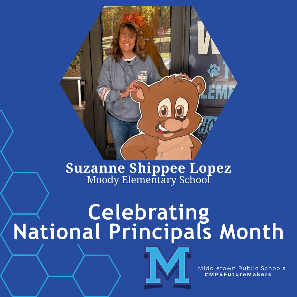 A woman in a grey hoodie standing in front of a large cardboard cutout of a cartoon bear. The image celebrates National Principals Month and includes school branding.