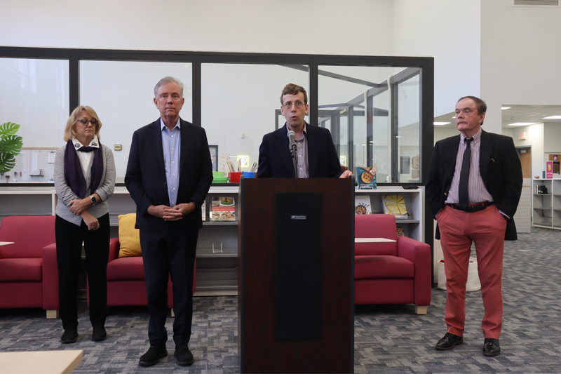 State Senator Matt Lesser speaks before high school students at MHS, joined by Gov Ned Lamont, State Sen Jan Hochadel and Middletown Mayor Gene Nocera.