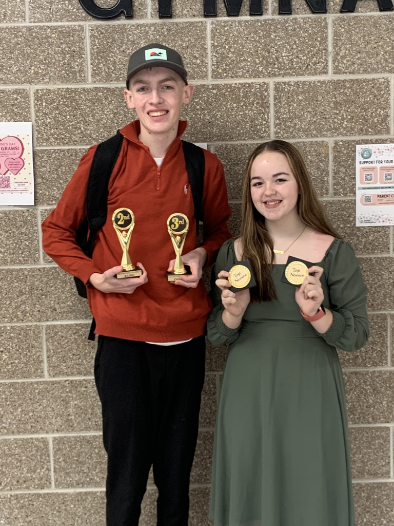 Grandin Black and Heidi Ramsey display their speech awards. 