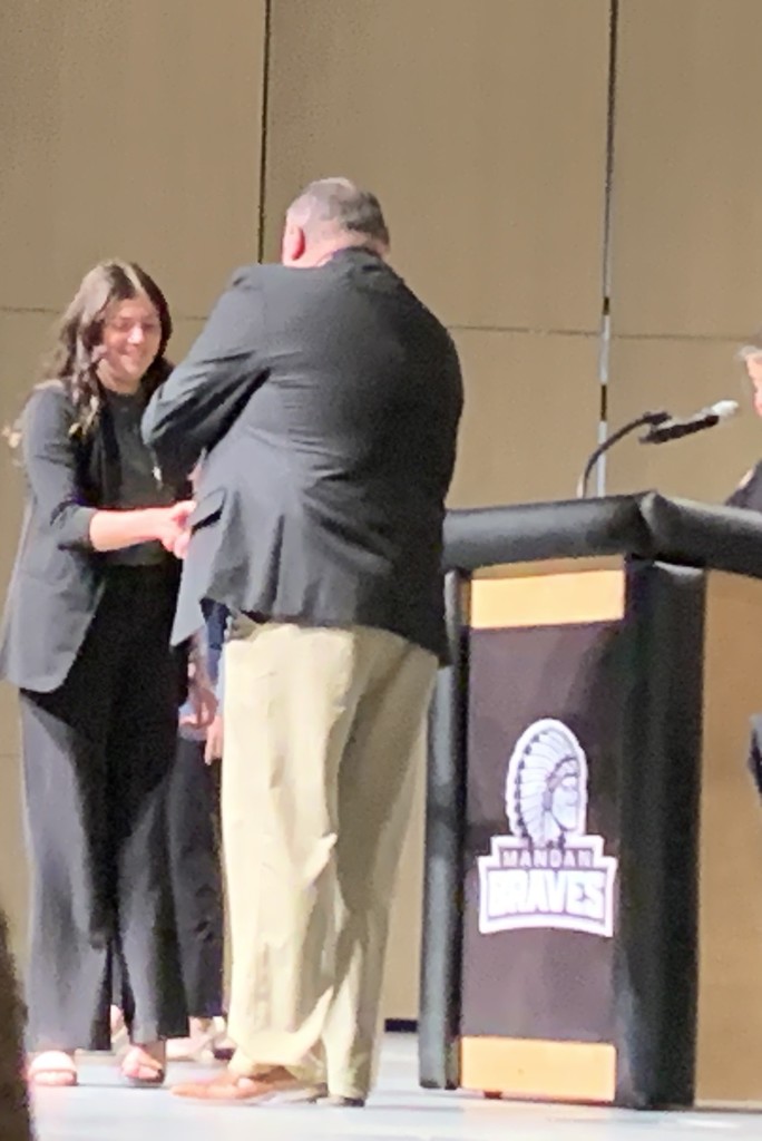 Haylie accepting her Impromptu award