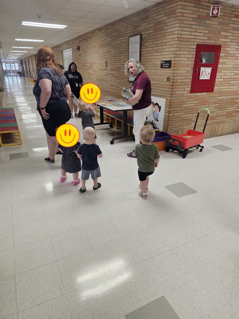 Children getting books.