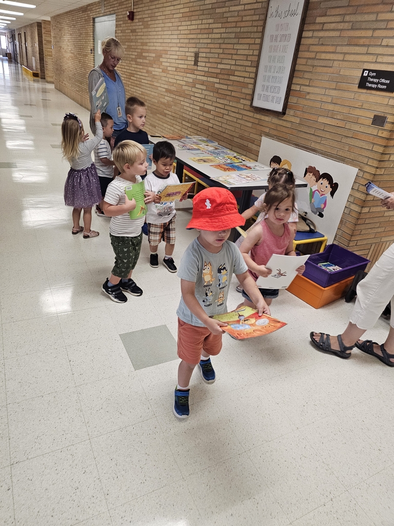 Children getting books.