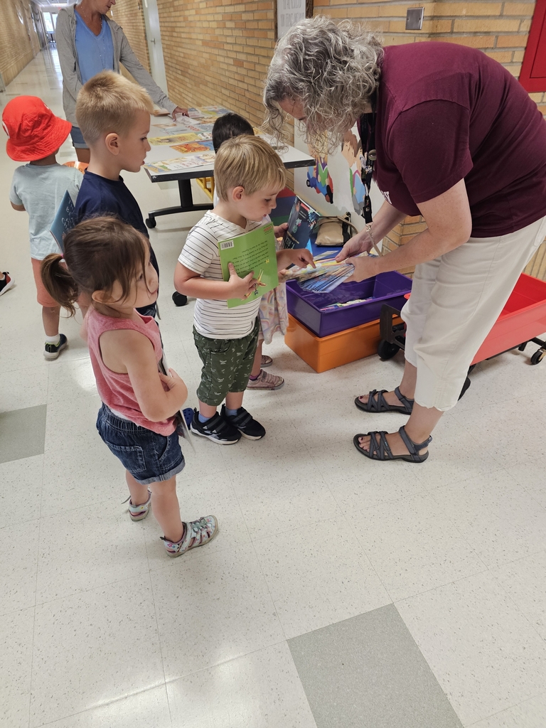 Children getting books.