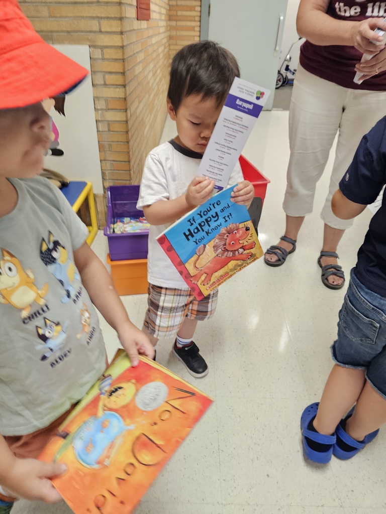Children getting books.