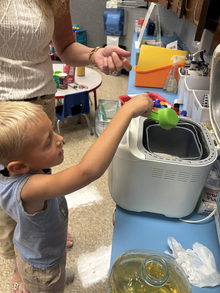 putting in the ingredients in the bread maker.