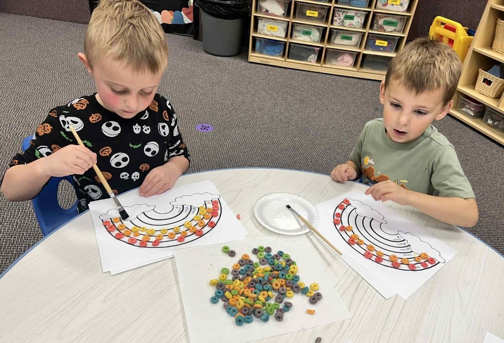 2 boys making rainbows