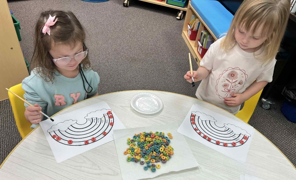 2 girls making rainbows