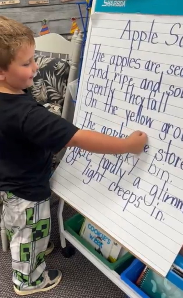 a boy reading a poem