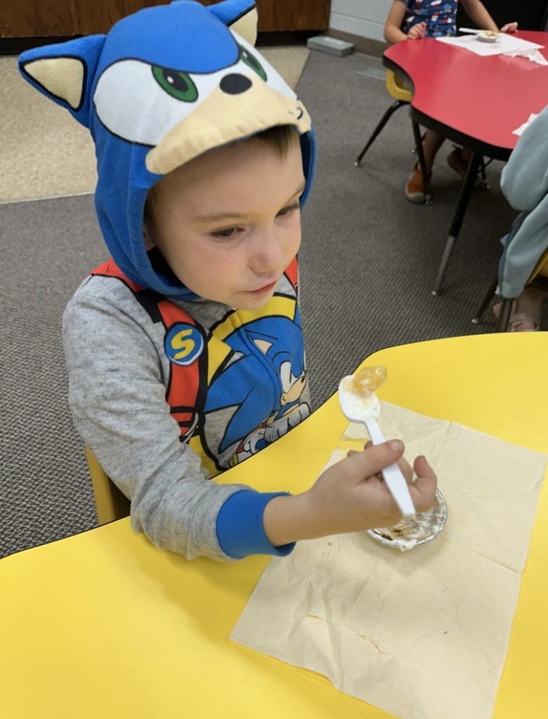 a boy eating pie