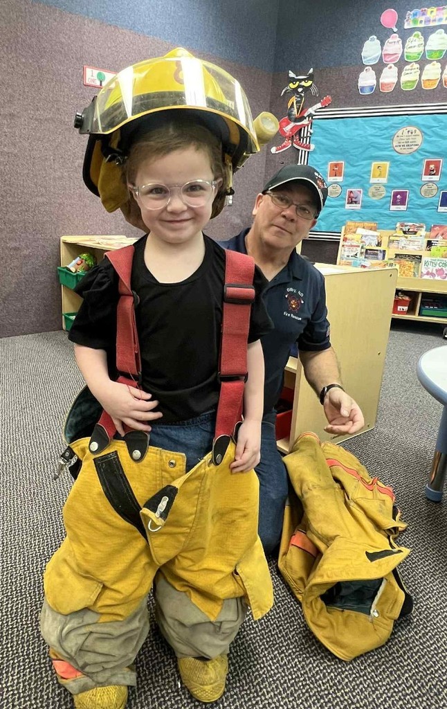 a kid trying on the suit