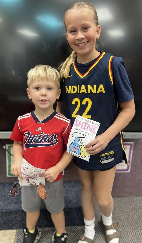 2 kids sharing their cards.