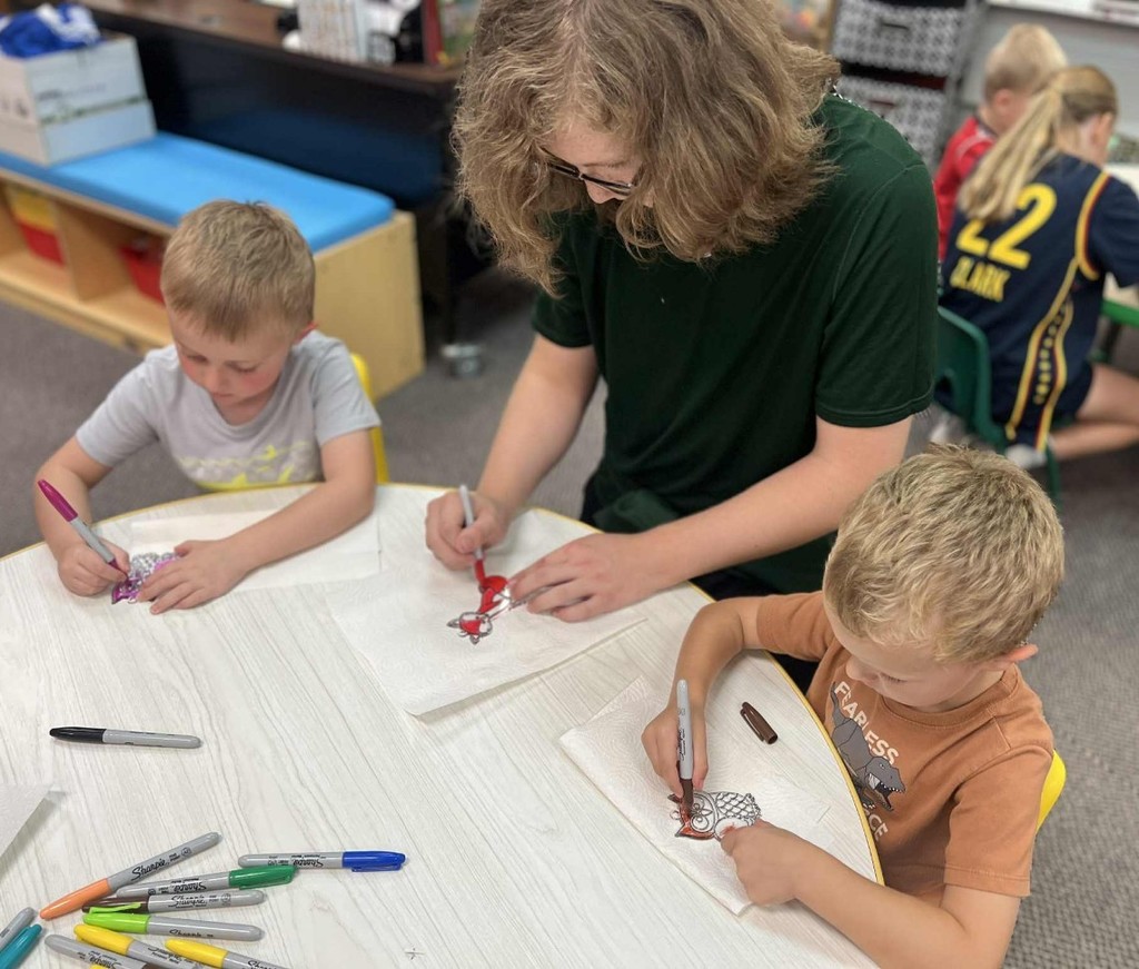 3 boys making cards 