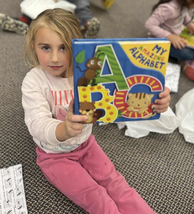 a girl and her alphabet book