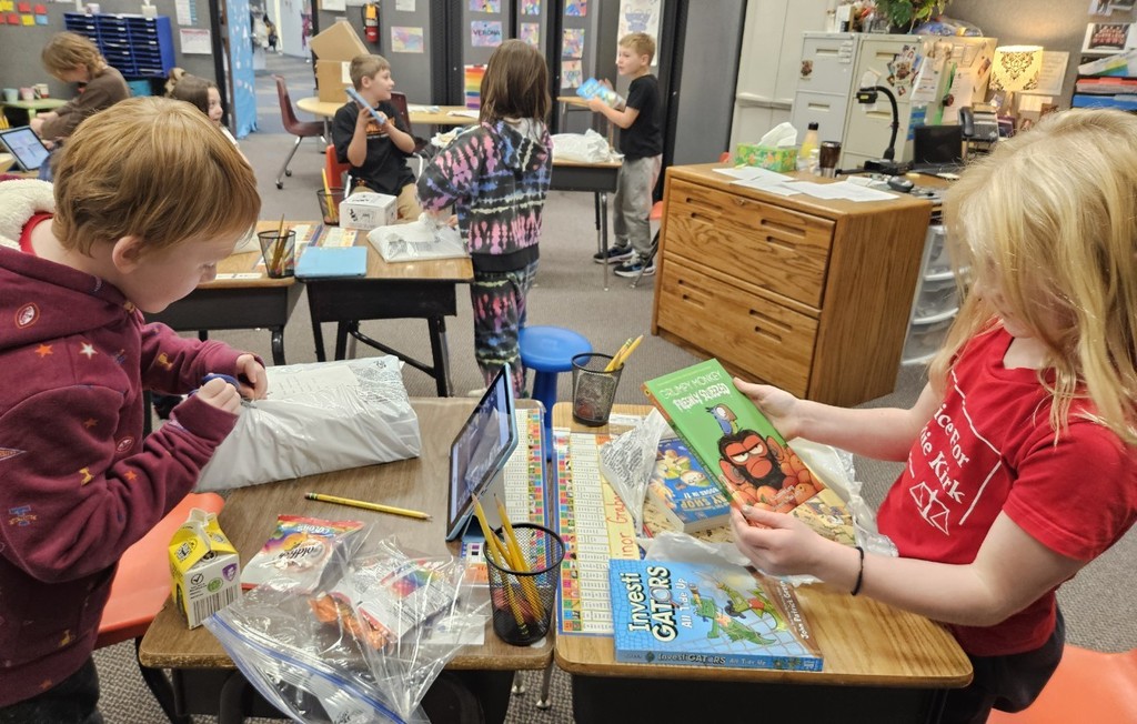 kids opening their books.