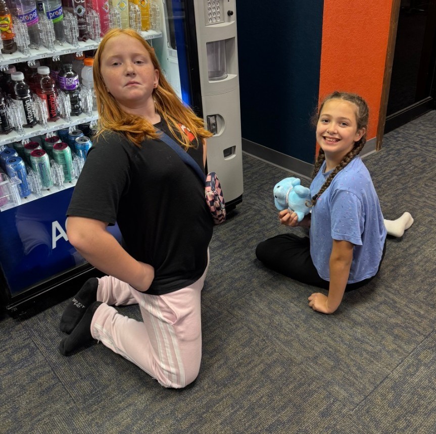 2 girls getting snacks