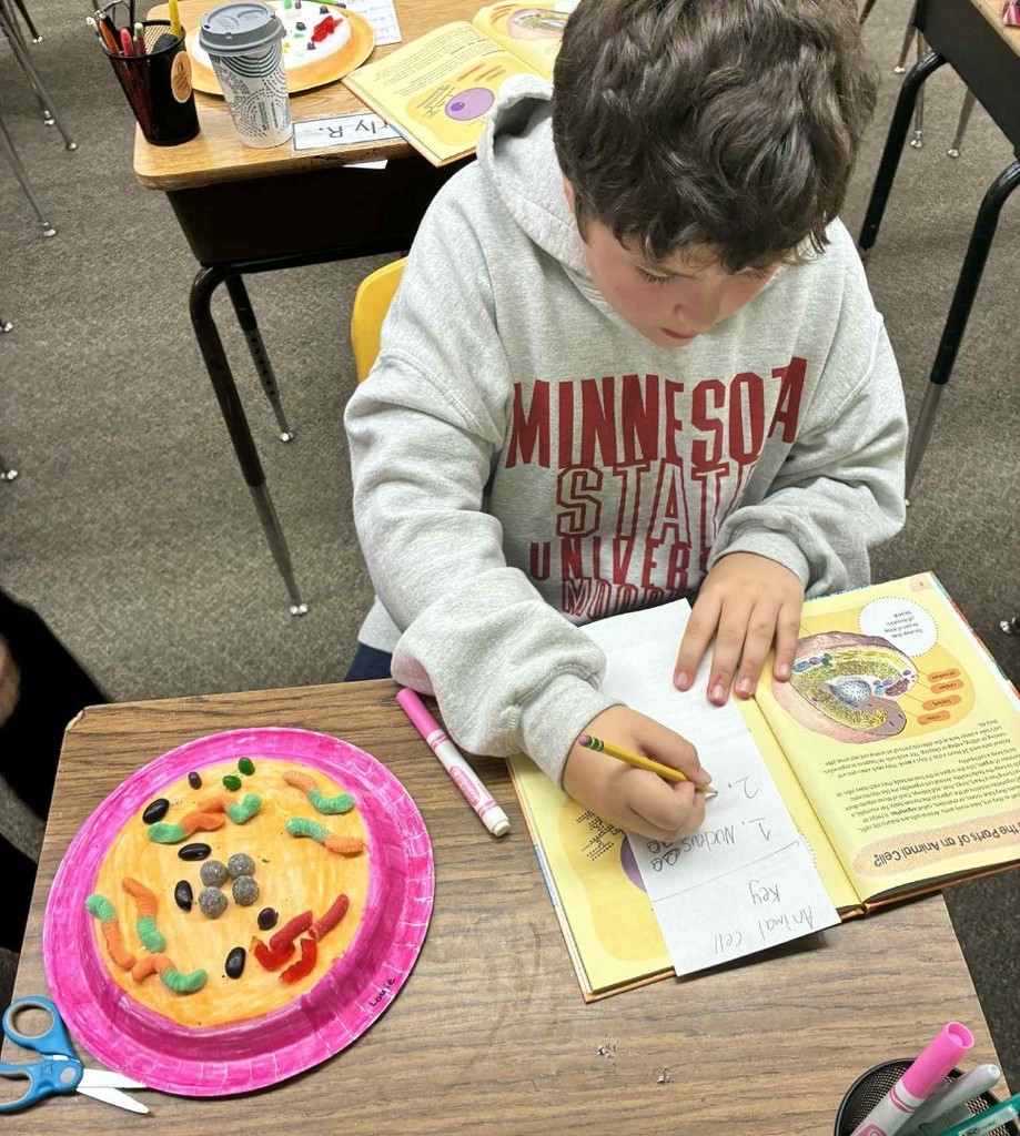 a boy making a cell.