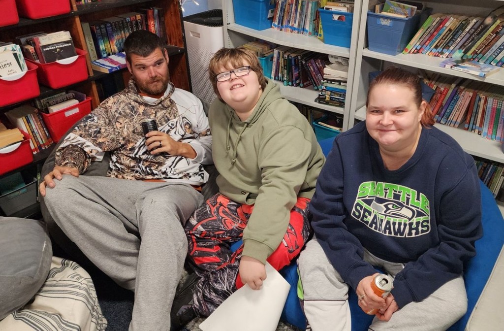 a kids sharing stories with parents.