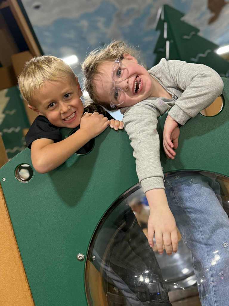 2 friends on the playground playset.