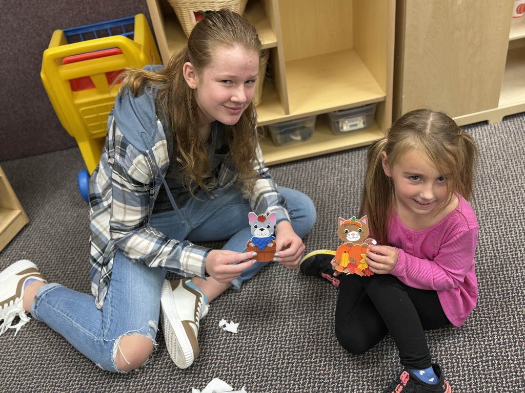 2 girls making foxes