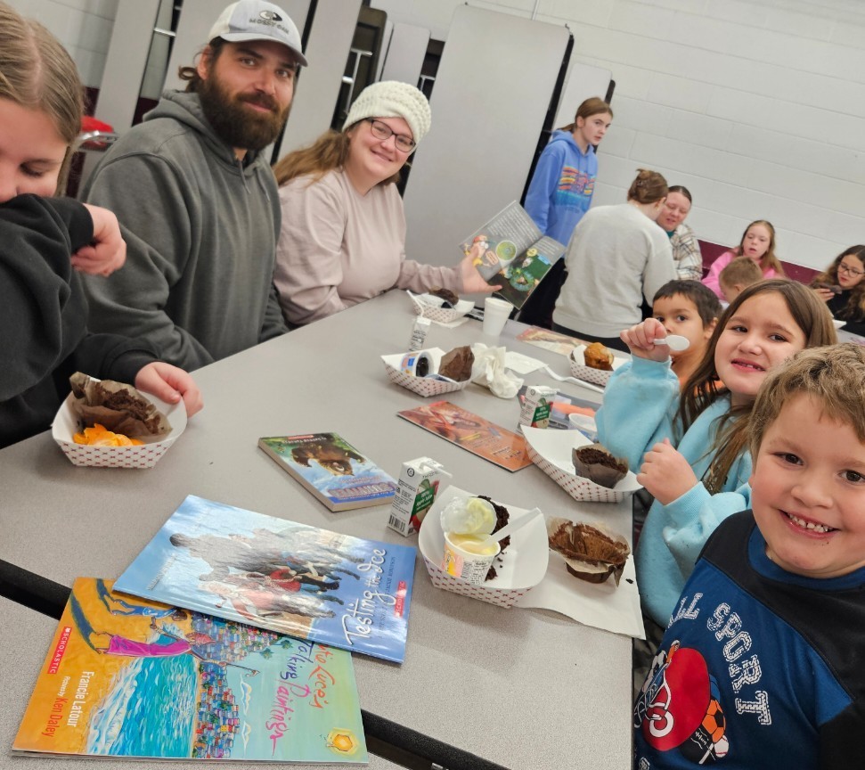 a family reading and eating