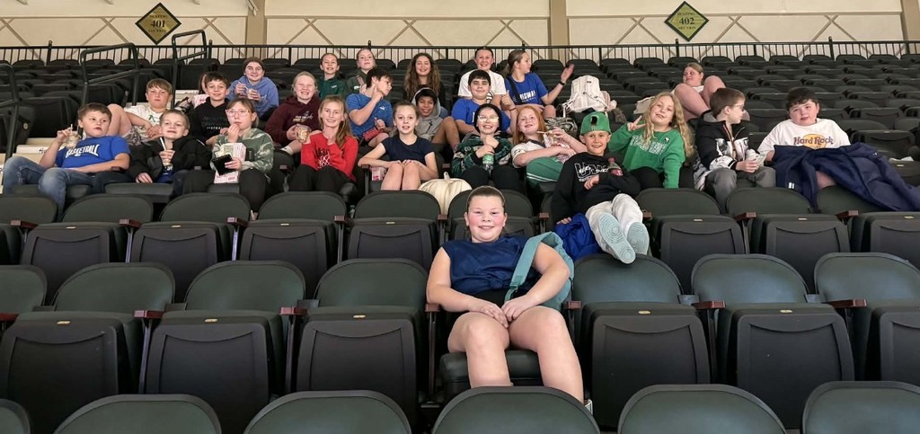 the kids sitting in the seats