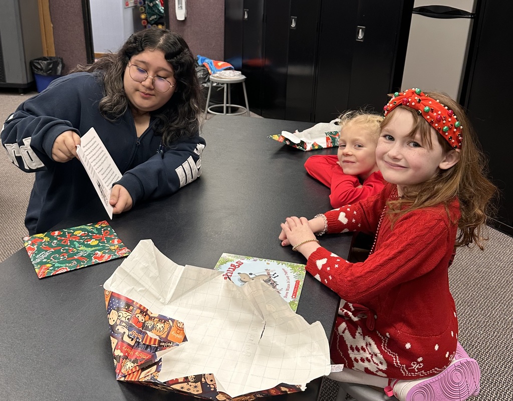girls reading books.