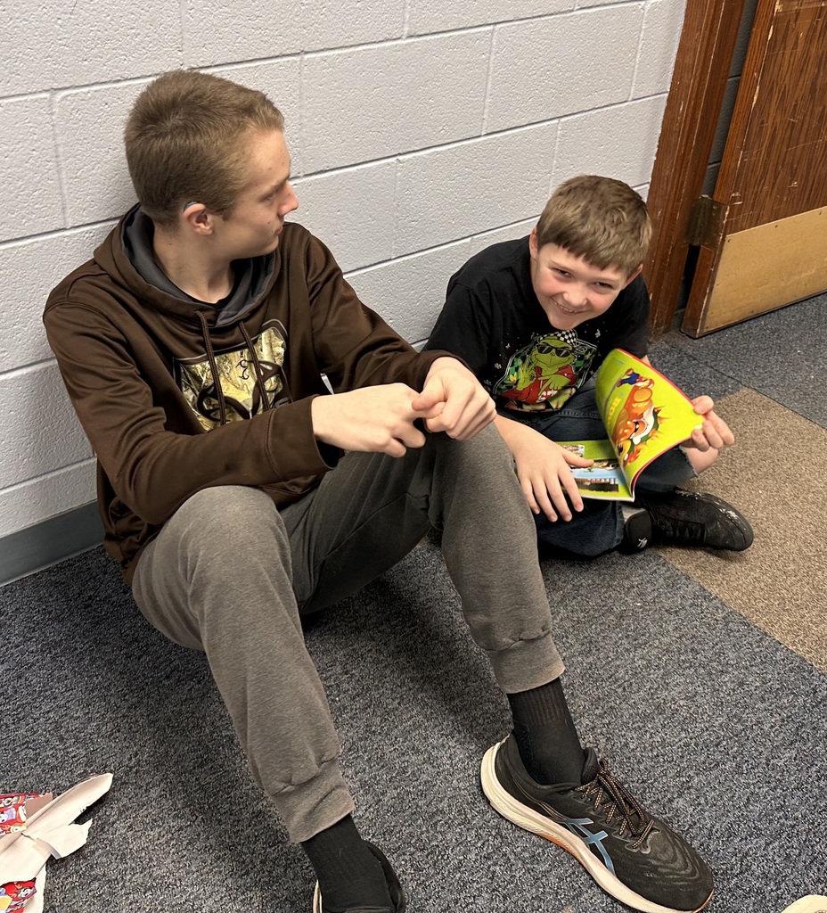 a boy reading a book.