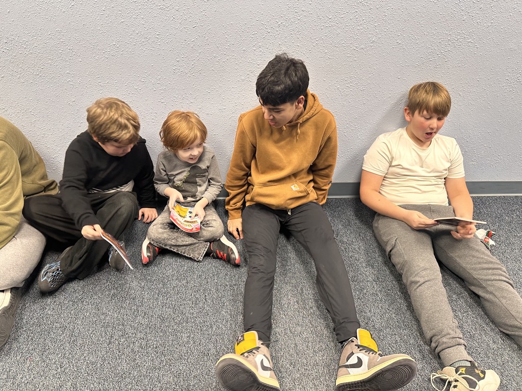 boys reading books.