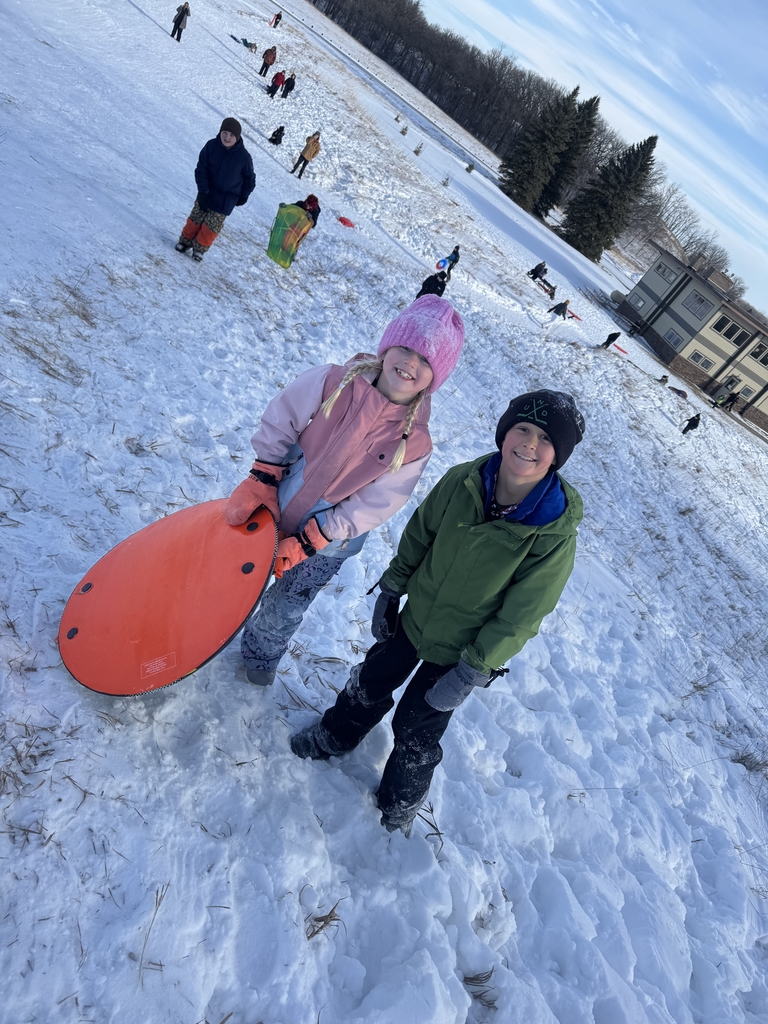2 kids climbing up the hill