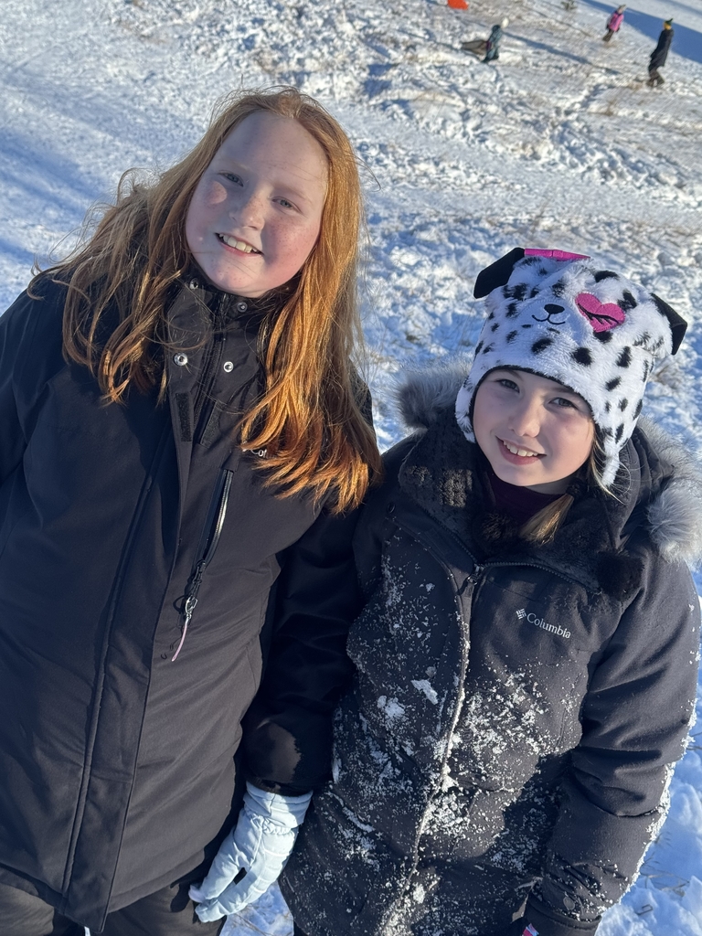 2 girls climbing up the hill.