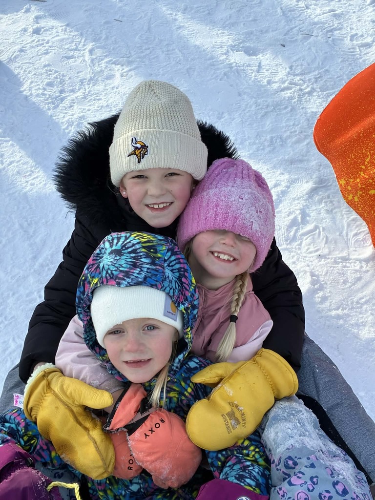 3 kids ready to go down the hill