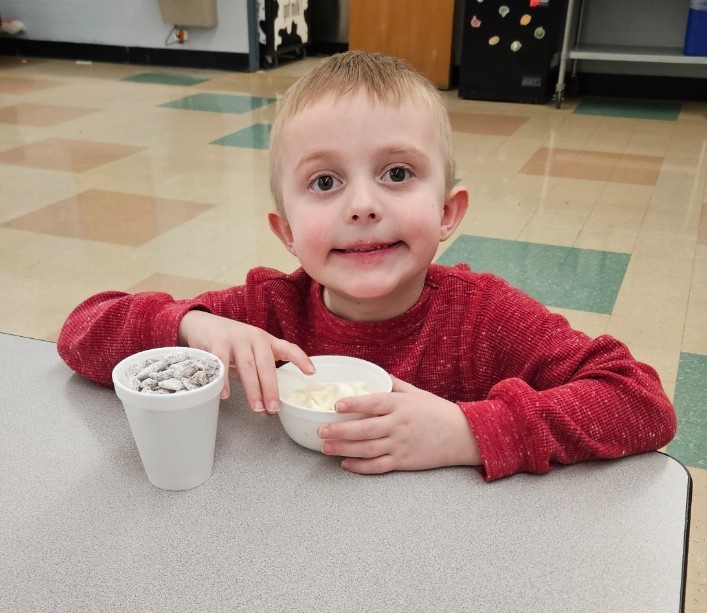 a boy enjoying a tasty treat