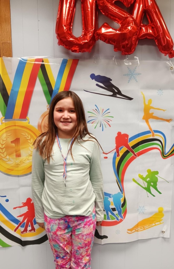 a girl and her medal