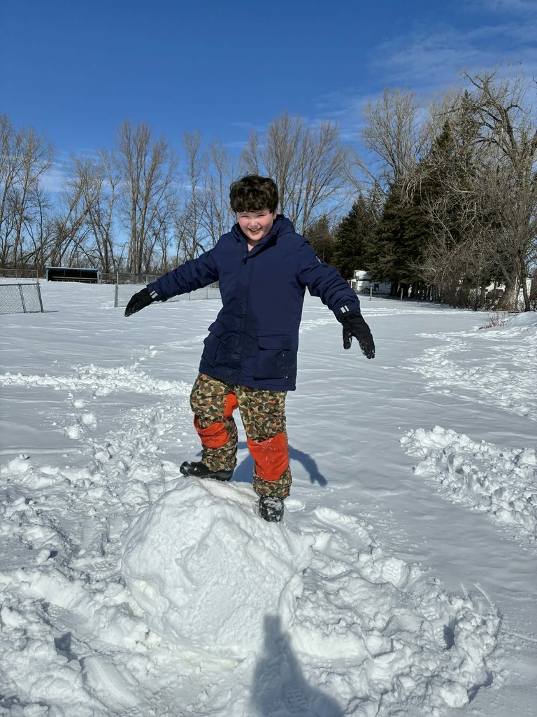 a boy on a snowball