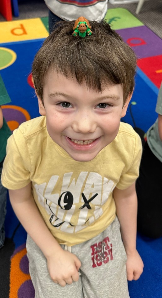 a kid with his animal on his head
