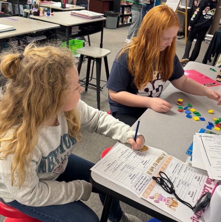 2 girls stacking blocks