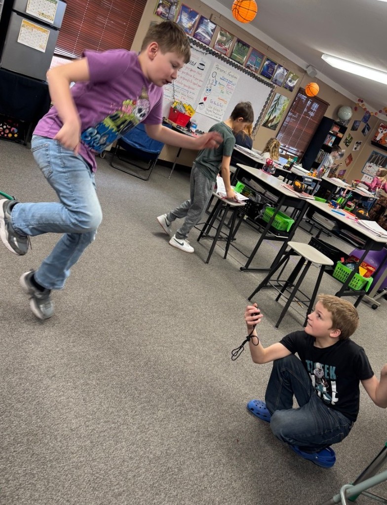 a boy hopping on one foot