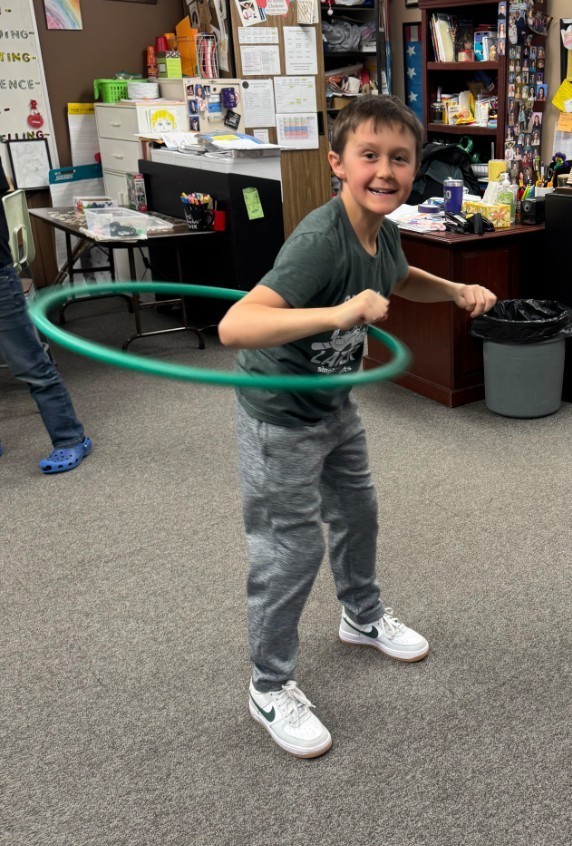 a boy hula hooping