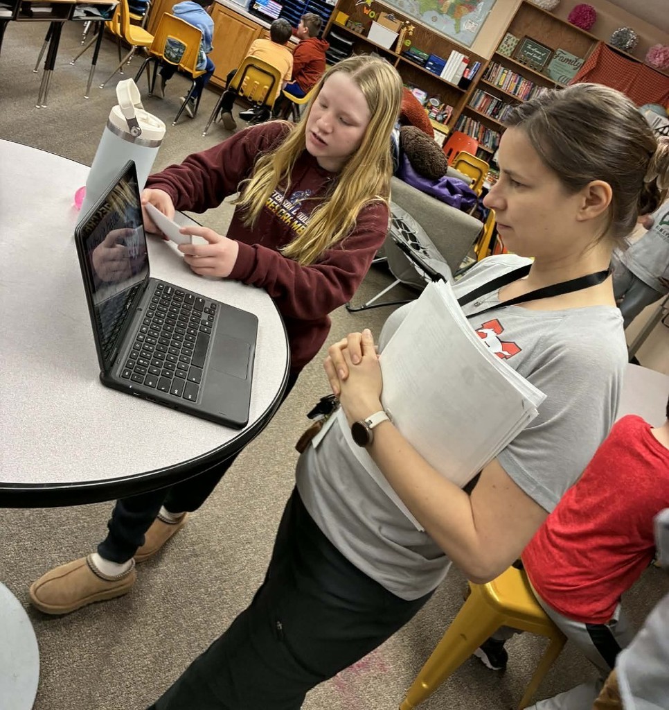 a girl presenting to a teachet