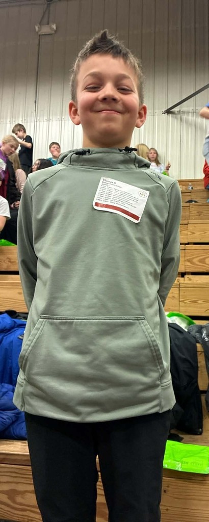 a boy with his schedule on his shirt