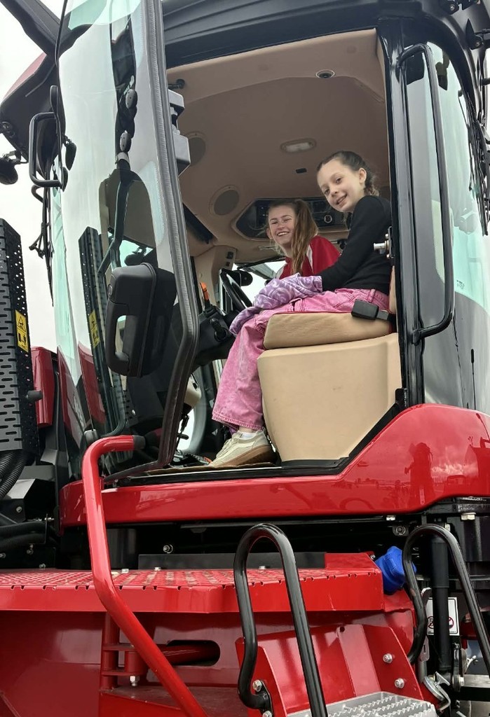 the girls in a tractor