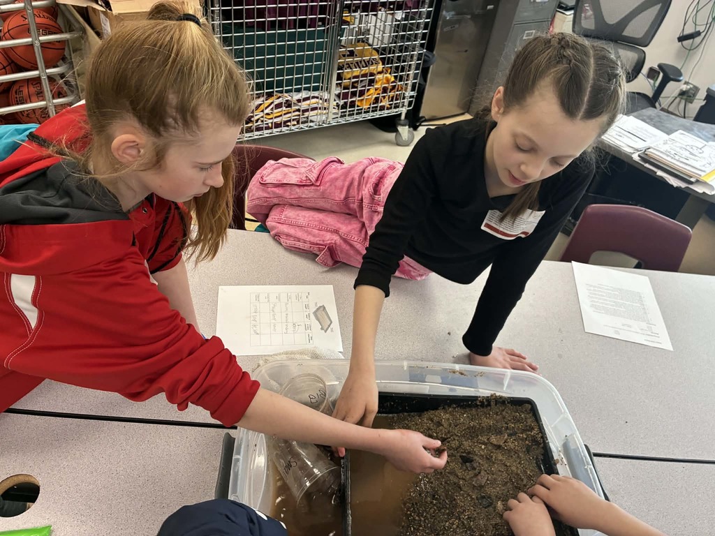 girls playing in ghe mud