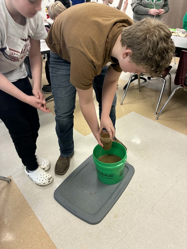 boys playing in the mud.