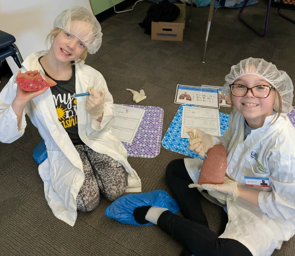 2 girls performing surgery